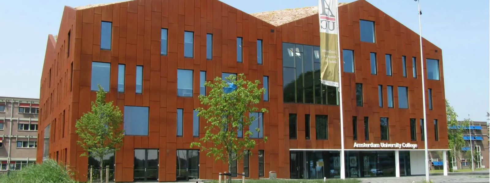 The weathered-steel facade of the Amsterdam University College building