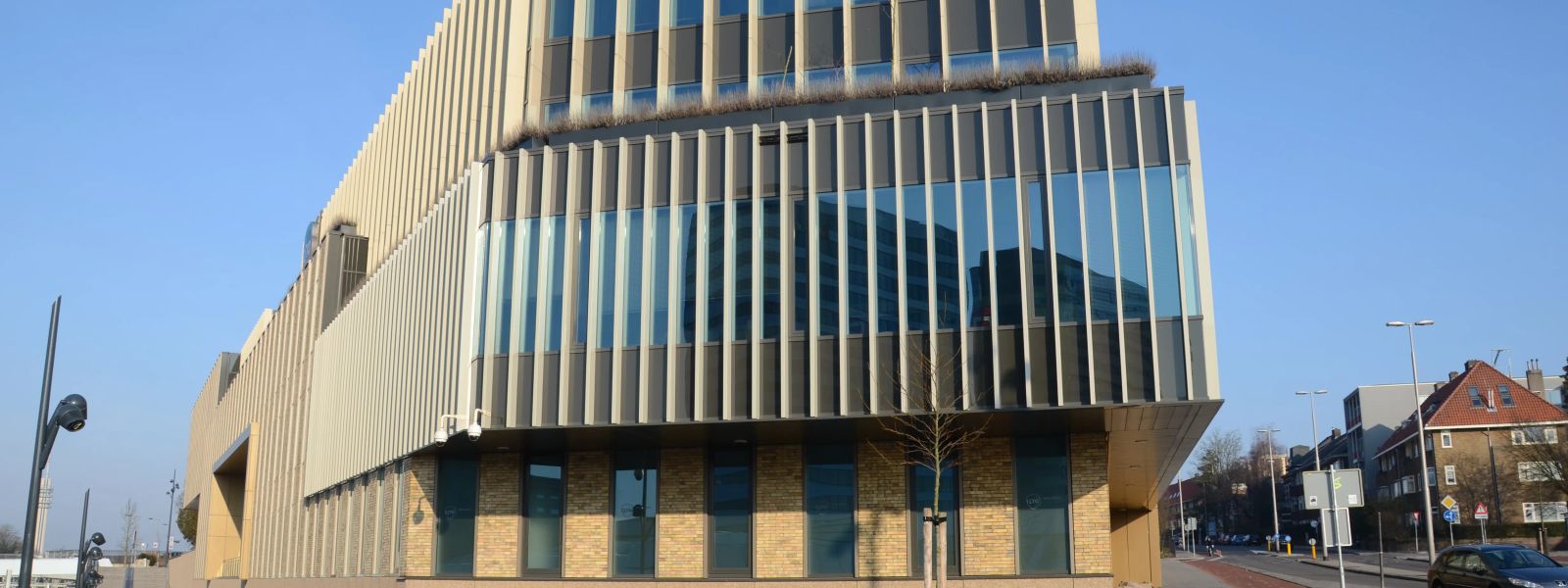 The angular, fin-clad facade of the Cito building seen from the street