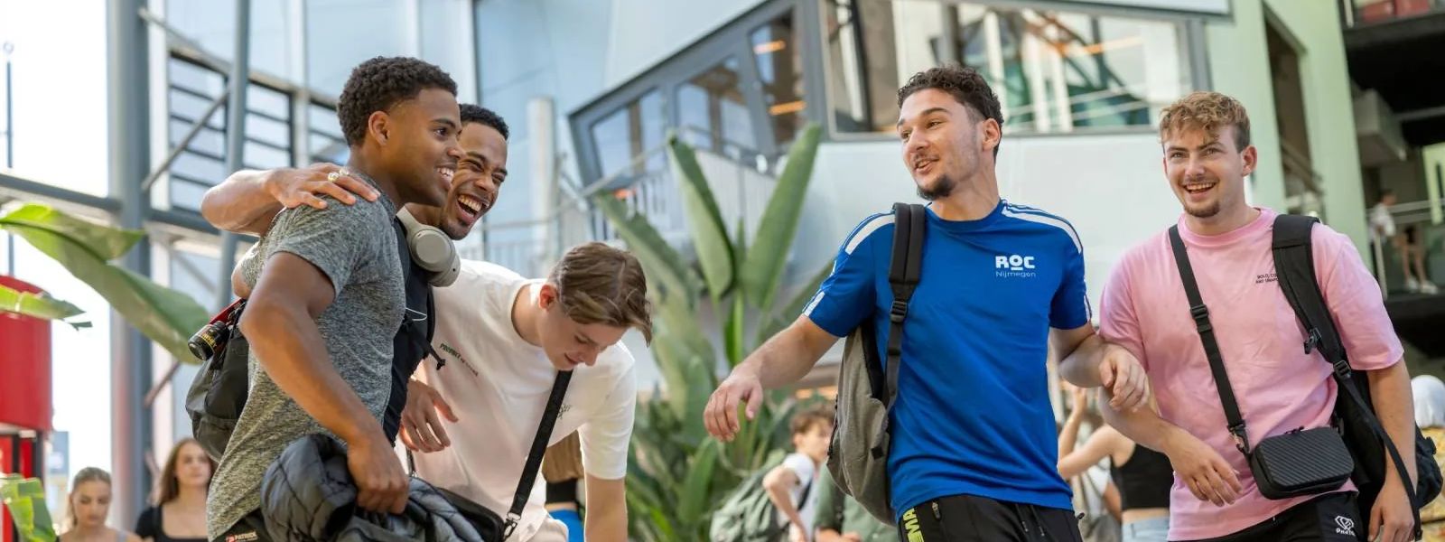 Students walking together through the atrium at ROC Nijmegen